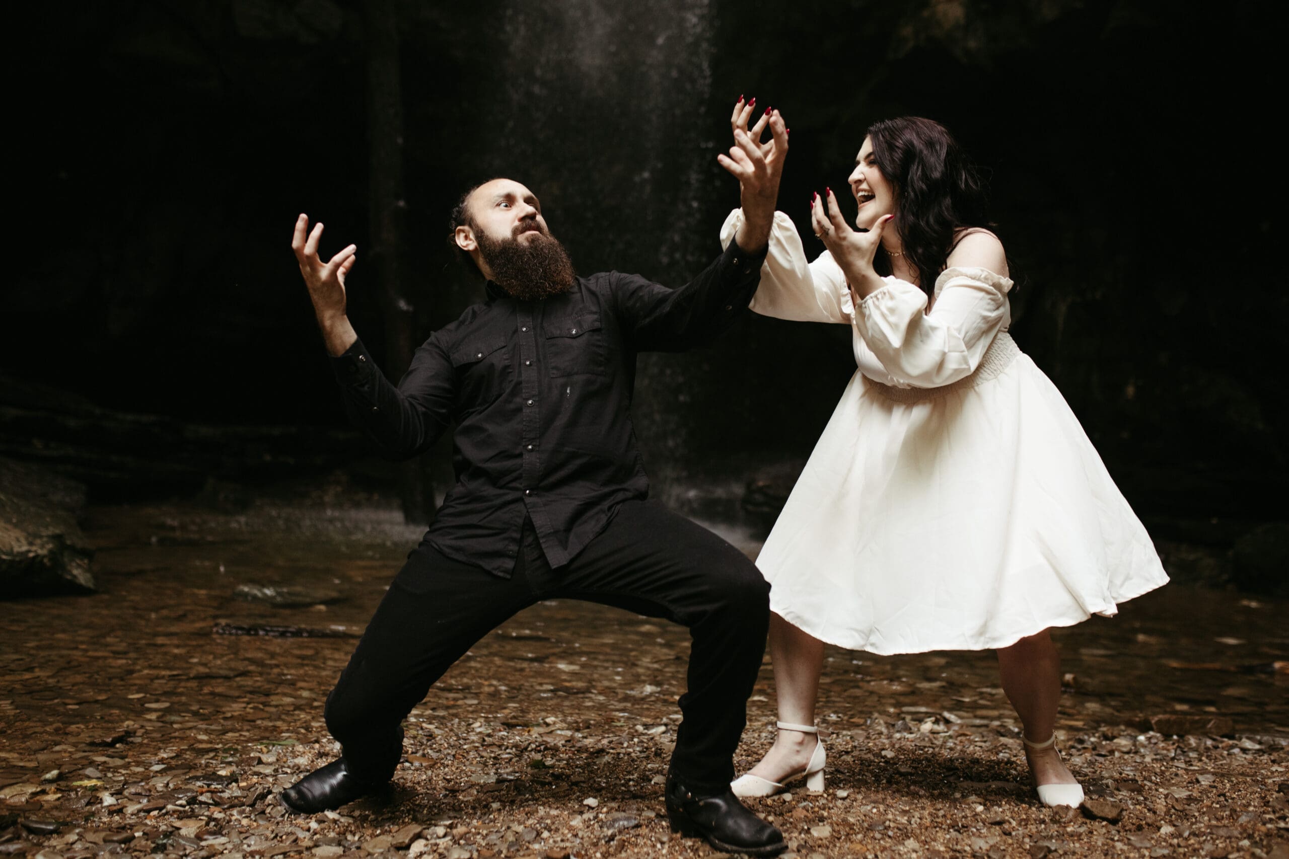 waterfall nature, white dress, black clothes